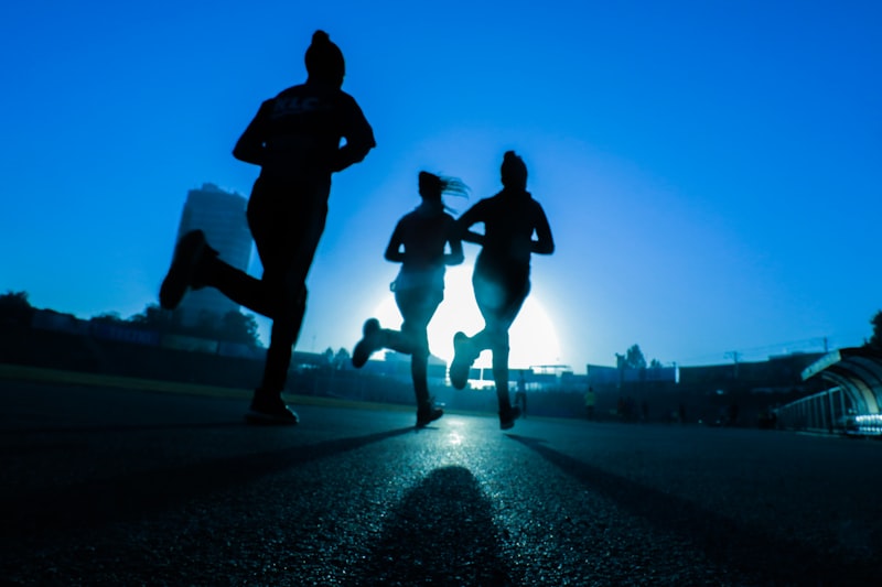 Friends running together at dawn