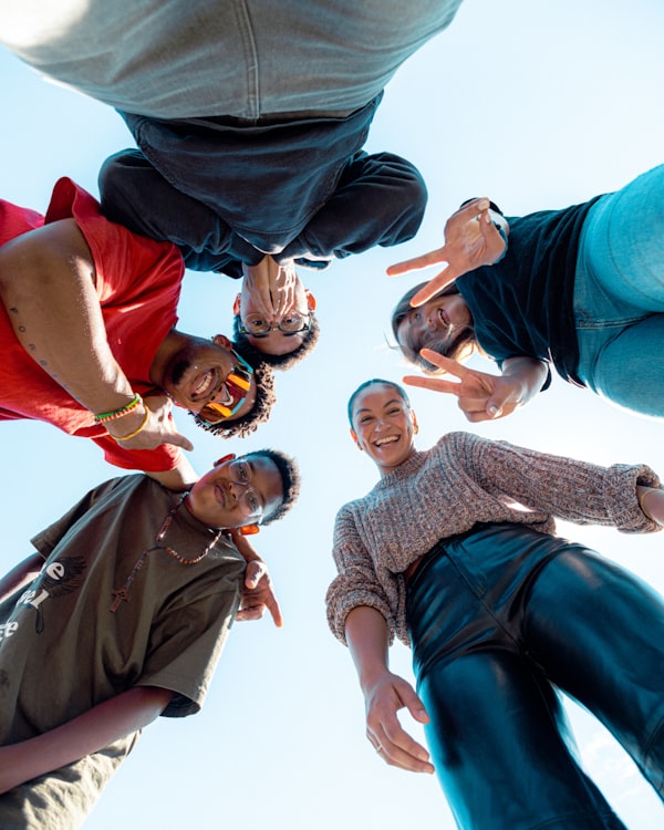 A group standing together in a circle outdoors